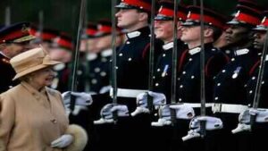When Queen Elizabeth II smiled at Prince Harry, his reaction said everything