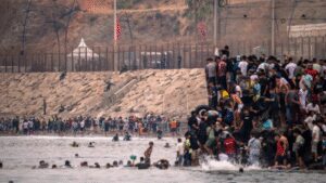 Footage shows chaos at Spain-Morocco border as thousands try to swim across; 34 dead