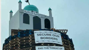 Mosque effigy atop Northern Ireland bonfire sparks outrage; man arrested after anti-Muslim display