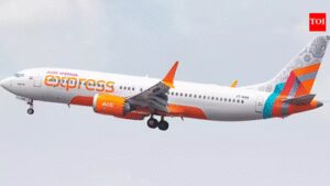 Air India Express passenger carrying weapon fires round at Varanasi airport; 2 injured
