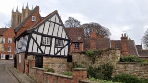 In 1933, Lincoln’s Crooked House was marked for demolition; work revealed a hidden timber-framed building behind its brick façade and saved it; today it is one of the Cathedral Quarter’s most photographed buildings