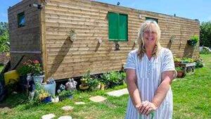 A West Sussex widow transformed £57,000 fly-tipped wasteland into a dream mini-farm with pigs, chickens and 2,000 plants; now she has been ordered to tear it down after losing a planning battle