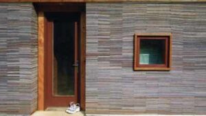 In 2002, Alabama architecture students stacked 72,000 worn carpet tiles into the walls of a family home; Rural Studio has now built more than 200 projects