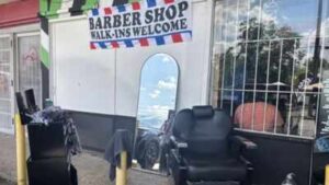 A San Antonio storm knocked out power and damaged homes; one barber simply moved his chair outside and kept cutting customers’ hair