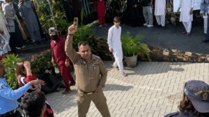 Pakistan army officer pulls gun, fires in air amid student protest at Peshawar university- video