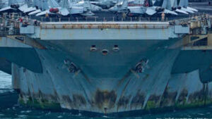 Rust streaks, faded paint and 5,000 tired sailors: War-weary USS Lincoln docks in Thailand