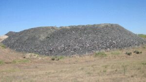In 2002, Idaho buried nearly 300 tons of crushed waste glass beneath Highway 75; the material formed 8 to 12 inches of fill under a 200-foot road section