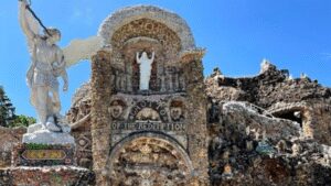 An Iowa priest vowed to build a shrine if he survived pneumonia; after recovering, he spent 42 years using over 100 train carloads of stone to create it